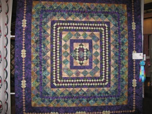 King Plus batik quilt I quilted for Barb Kiehn.  This quilt hangs straight.